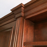 oak panelling with fancy coving detail pillars and bookcases belgravia london finished in a rich dark colour