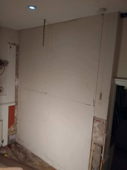 Before.An unsightly Plasterboarded wall. before the quick fit shaker wall panelling makeover